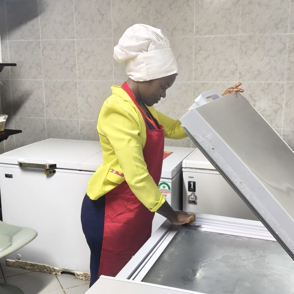 Trainer inspecting the freezer